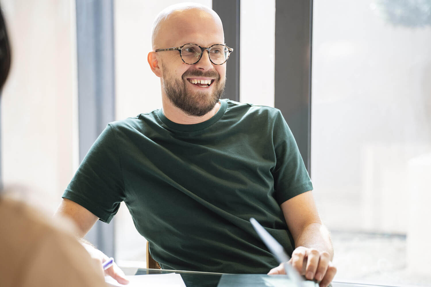 Casually dressed smiling male academic