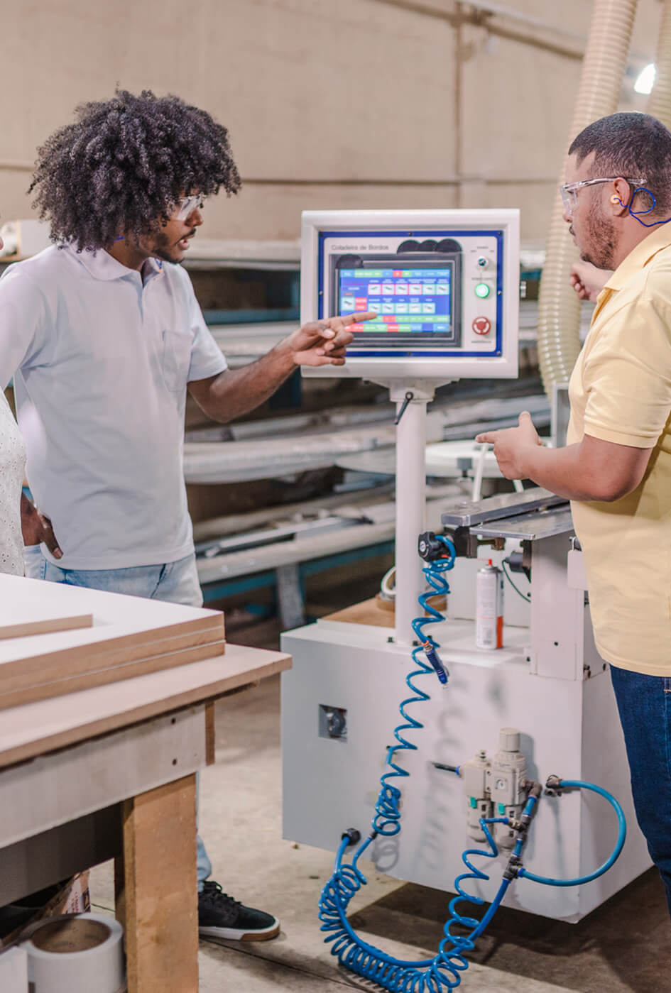 A student and tutor in an engineering workshop