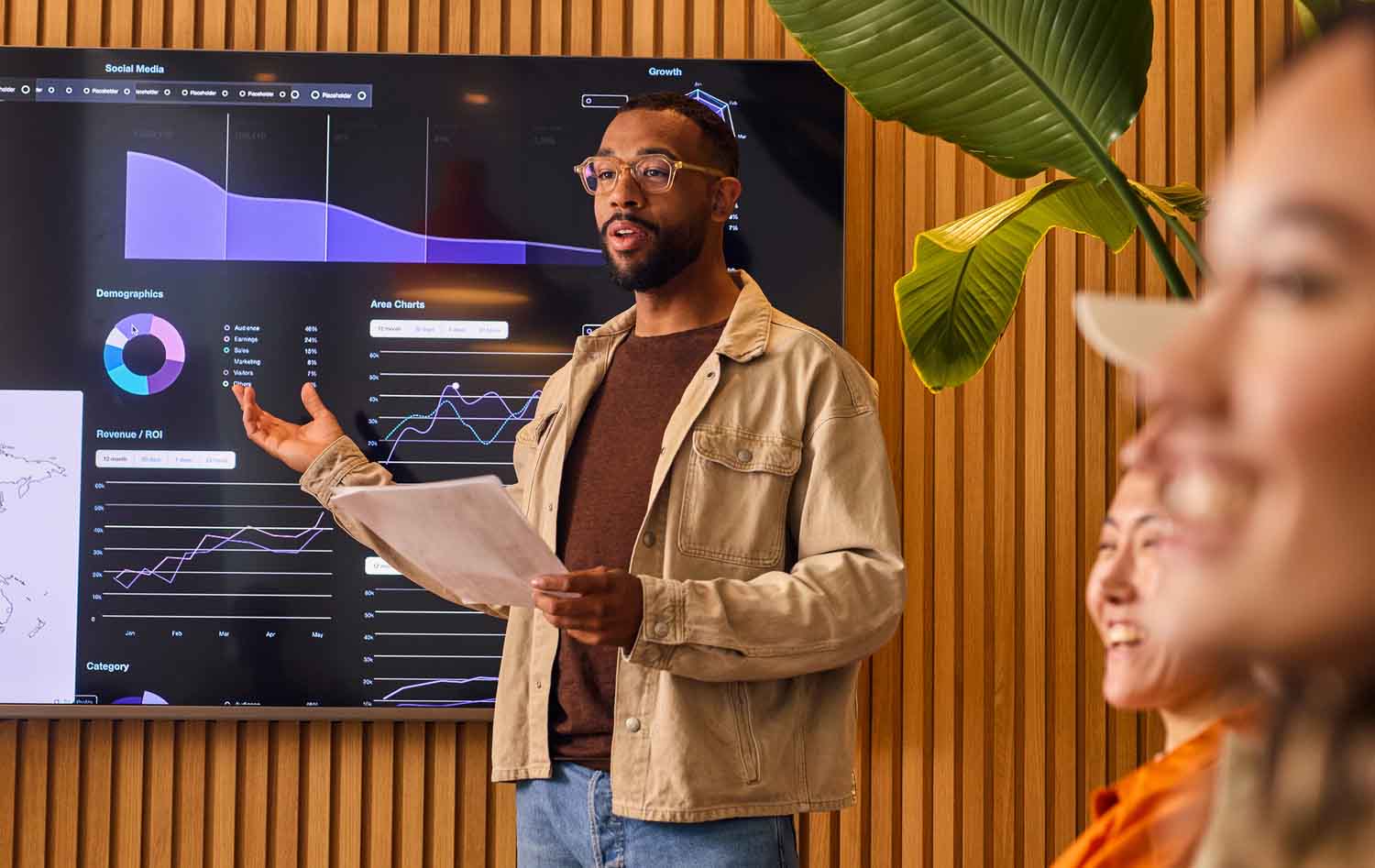 Lecturer standing in front of an electronic board